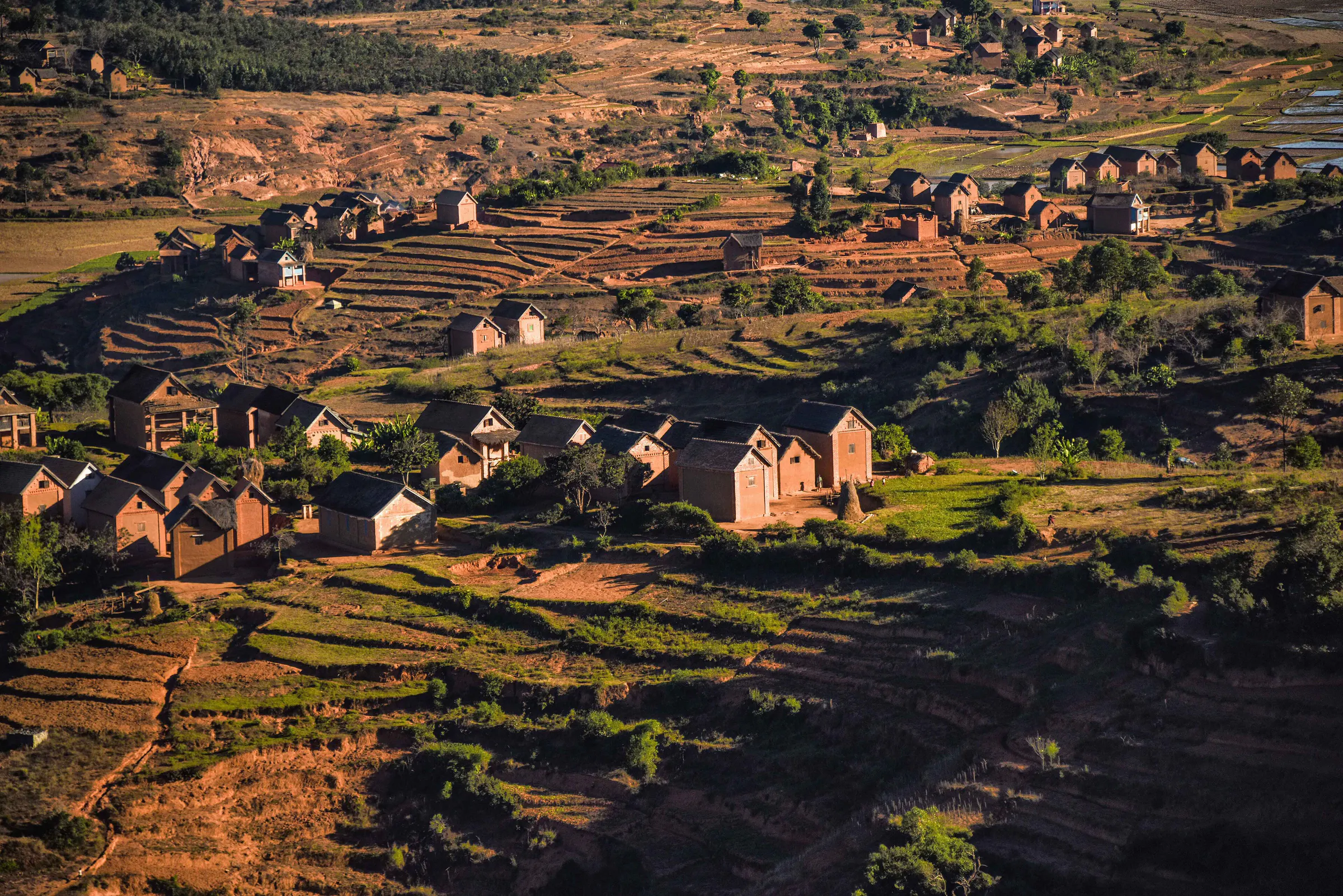 Highland village and its terraced rice paddies at sunrise